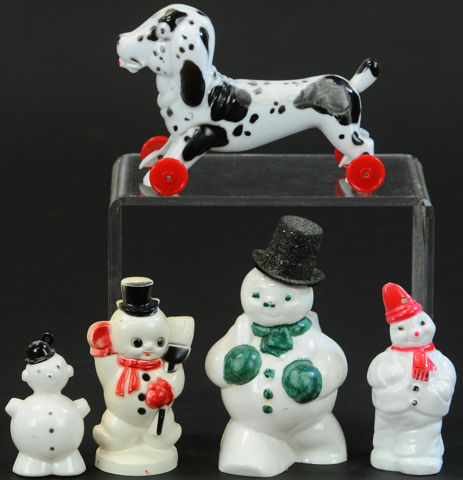 ROSBRO LARGE SNOWMAN, DALMATION WITH SMALLER SNOWM: 1183. ROSBRO LARGE SNOWMAN, DALMATION WITH SMALLER SNOWM | A rare dalmatian on wheels and four snowmen, including a rare one with glitter top hat. | 2.5"-5" h. | (VG-Exc. Cond.) | $100 - $300