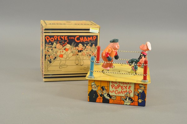 POPEYE THE CHAMP WITH ORIGINAL BOX: Japan, colorfully painted in familiar sailor suit, exceptional condition especially the colors which are not faded & still retain original bright richness. Wind-up action includes up & down head movem