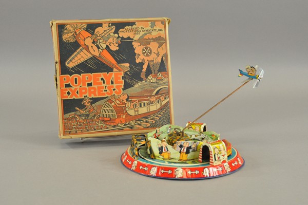 POPEYE EXPRESS WITH ORIGINAL BOX: Louis Marx, copyright King Features Synd., very colorful graphics, lithographed tin base features tunnels and trestle bridge, interior cardboard die-cut with characters, Popeye circles base in small a