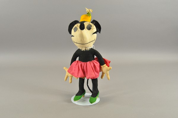 MINNIE MOUSE BY CHARLOTTE CLARK DOLL: Circa 1930's, stuffed doll, very colorful outfit, classic eye brows and die-cut eyes, depicted in high heel shoes, hat with flowers and pink silk dress. 17" h.