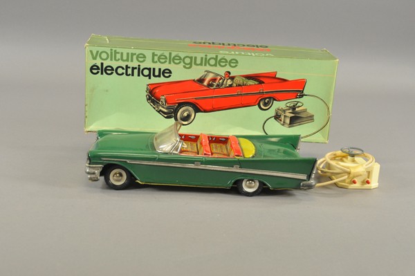 1957 CHRYSLER CONVERTIBLE WITH BOX: F.J. France, lithographed tin, done in green body, litho tin interior seating, features remote control box, has not been tested, sold as is. 13 3/4" l.