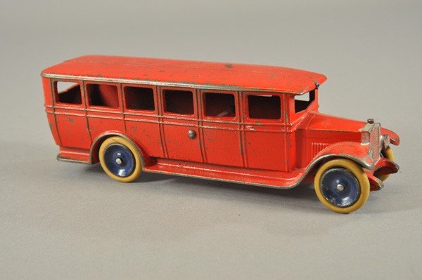 SETO BUS: Cast iron Swedish made bus by Skoglund & Olson, one of the very few cast iron European toys made, painted in red, blue disc wheels, rubber tires. 10 1/2" l.
