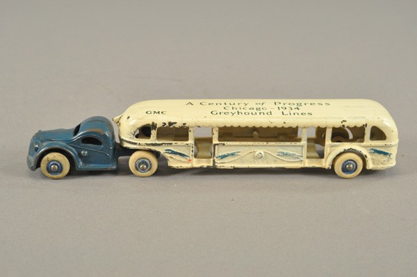 ARCADE GREYHOUND BUS: c. mid 1930's, cast iron tandem bus, roof stenciled, "Century of Progress Chicago -1934," rubber tires. 10 1/4" l.