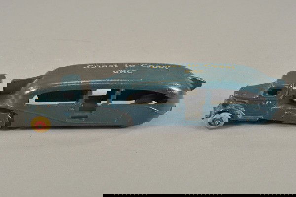 ARCADE "COAST TO COAST" GMC BUS: 1930's, cast iron, painted in blue overall, tandem bus embossed with Greyhounds on sides, rubber tires. 10 1/2" l.