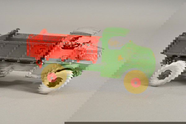 HUBLEY MACK DUMP TRUCK: c. 1930's, cast iron, green painted cab with open bed body, able to tilt for unloading when lever is depressed, rubber tires, dual on rear, nickel driver. 11" l.