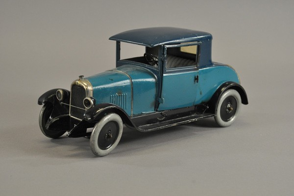 CITROEN C4 COUPE: France, c. late 1920's, done in attractive light blue body and dark blue roof, spare mounted on trunk, opening doors, clockwork driven, familiar details, embossed seating, dummy lights, nickel grille.