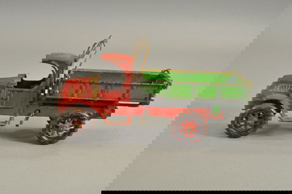 KENTON MACK LIFT DUMP TRUCK: Mid 1920's, cast iron, red "C" cab with green open dump body, spoke wheels, side crank turns to activate tilting, tail gate opens. 11" l.