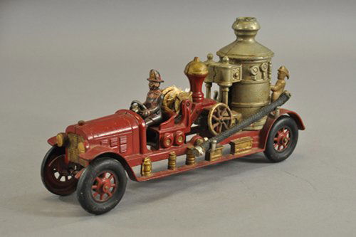 KENTON FIRE PUMPER: c. 1930's, cast iron, open bench seat, service body features vertical boiler and hose reel, extensive casting effects and details; side hose supports, two riders, nickel lever, spoke wheels, ex. Gotts