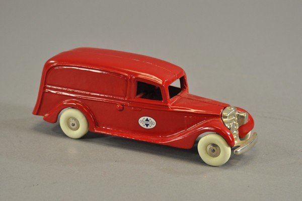 THOMAS TOY INTERNATIONAL PANEL VAN: Contemporary, lead, well cast and scaled, painted in red body, nickel grille, rubber tires. 9" l.