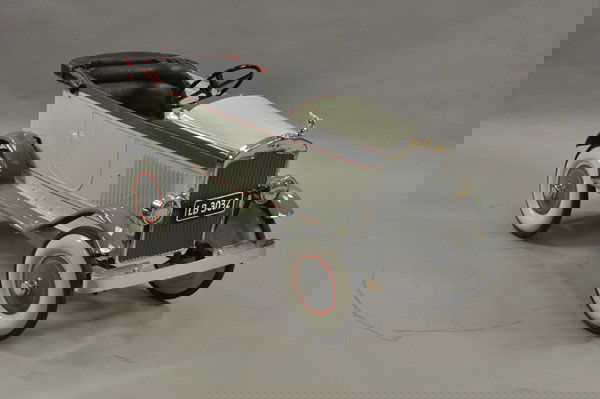 1938 TRIANG CHEVROLET PEDAL CAR: Pressed steel example, crafted from a TRIANG car, painted in grey body, red striping, disc wheels, rubber tires, opening side door, soft top-down, dummy lights, well crafted, great decorative car. 44"