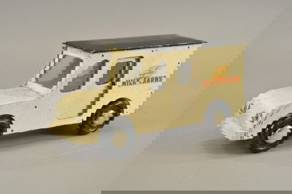 BUDDY "L" WOOD MILK TRUCK: c. 1946, all wood panel delivery van, painted in white, black roof and wheels, decals on sides, opening side doors, includes bottle carton with several bottles. 13 1/4" l.