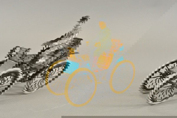 GUNTHERMANN VIS-À-VIS: Germany, c. 1895, one of the auto pioneers, lithographed tin, classic back to back seating, seated hand painted tin driver, rubber tires on spoke wheels, clockwork driven, very detailed blue body with