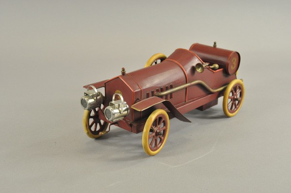 FRENCH RACER: c. 1905, similar to Pinard's Deluge Racer, hand painted in deep maroon, fuel tank prominent on rear of driver's seating, spare mounted on long bonnet, headlamps, rubber tires and spoke wheels, spare t