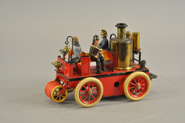 BING FIRE PUMPER: Germany, c. 1920, clockwork version of Fire truck with open bench seating, vertical boiler, rear platform , hose reel on front with headlamps and hand bell, rubber tires, spoke wheels, contains two fi