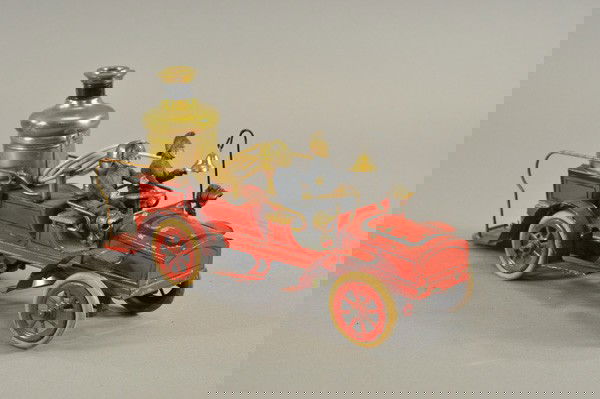 GUNTHERMANN FIRE PUMPER: Germany, c. 1900, hand painted tin, done in red body, vertical boiler on body with railed rear platform, clockwork driven, bell appears under bonnet, hand bell on dash, well detailed as this is one in