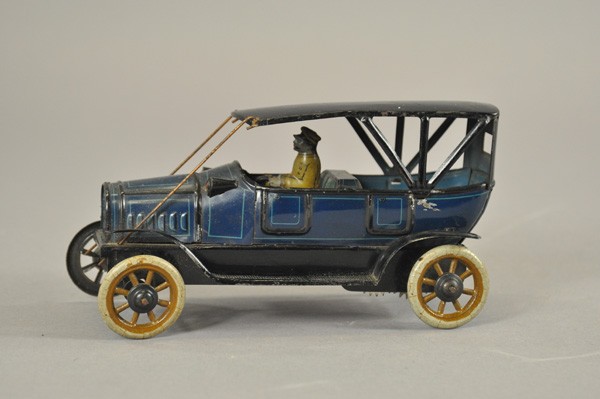 DISTLER TOURING CAR: Germany, c. 1920's, lithographed tin, blue body, black roof, light blue pin striping, seated driver, simulates soft top model, spoke wheels, clockwork driven. 7" l.