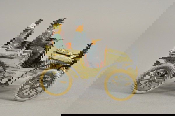 GUNTHERMANN TONNEAU: Germany, lithographed tin, rear entrance Tonneau features seated passengers and drivers, rubber tires on spoke wheels, clockwork driven. 7 1/2" l.