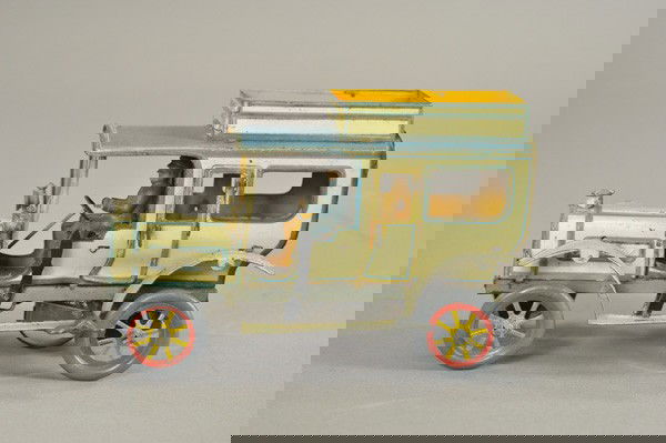 HANS EBERL LIMOUSINE: Germany, c. 1920, lithographed tin, done in white body, blue roof, seated driver, spoke wheels, bonnet has ornament and side lanterns, key wind operated. 7 1/2" l.