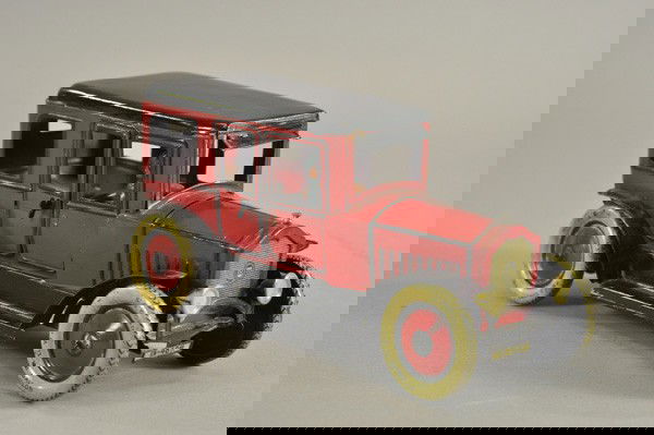 GUNTHERMANN LIMOUSINE: Germany, lithographed tin, rich deep red, black roof and fenders, seated driver, opening doors, clockwork mechanism, well detailed overall. 9 3/4" l.