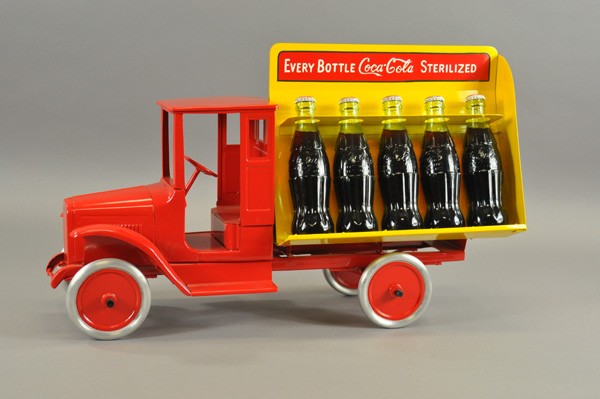 COMTEMPORARY BUDDY 'L' COCA COLA TRUCK: Created piece with a great fantasy design, red baby style cab, hand Metalcraft styled split body which holds ten bottles of cola, very colorful and detailed example. 25" l.