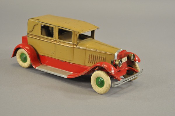 KINGSBURY LANDAU SEDAN: c. 1930, pressed steel, painted in brown body, red fenders, white rubber tires, "245" license plate, clockwork driven, electric lights. 12 1/2" l.