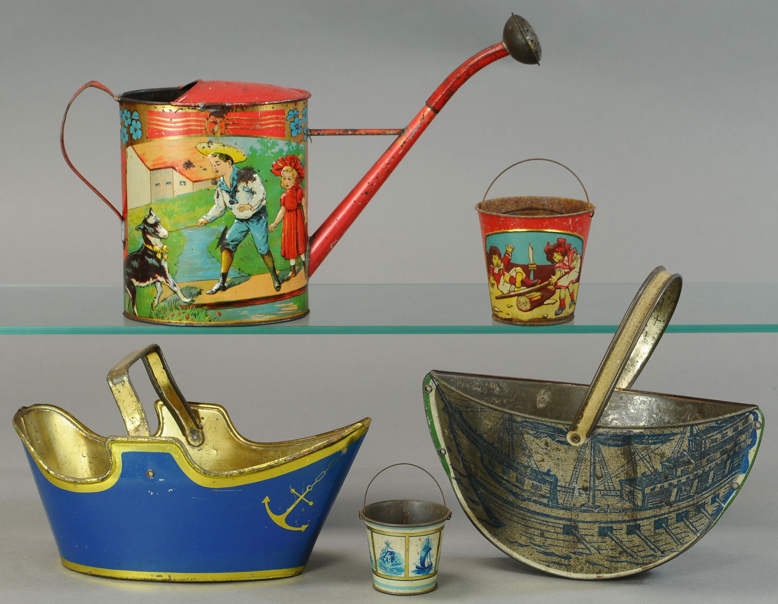 FOUR EARLY SANDPAILS AND AN EMBOSSED WATERING CAN (1 of 2)