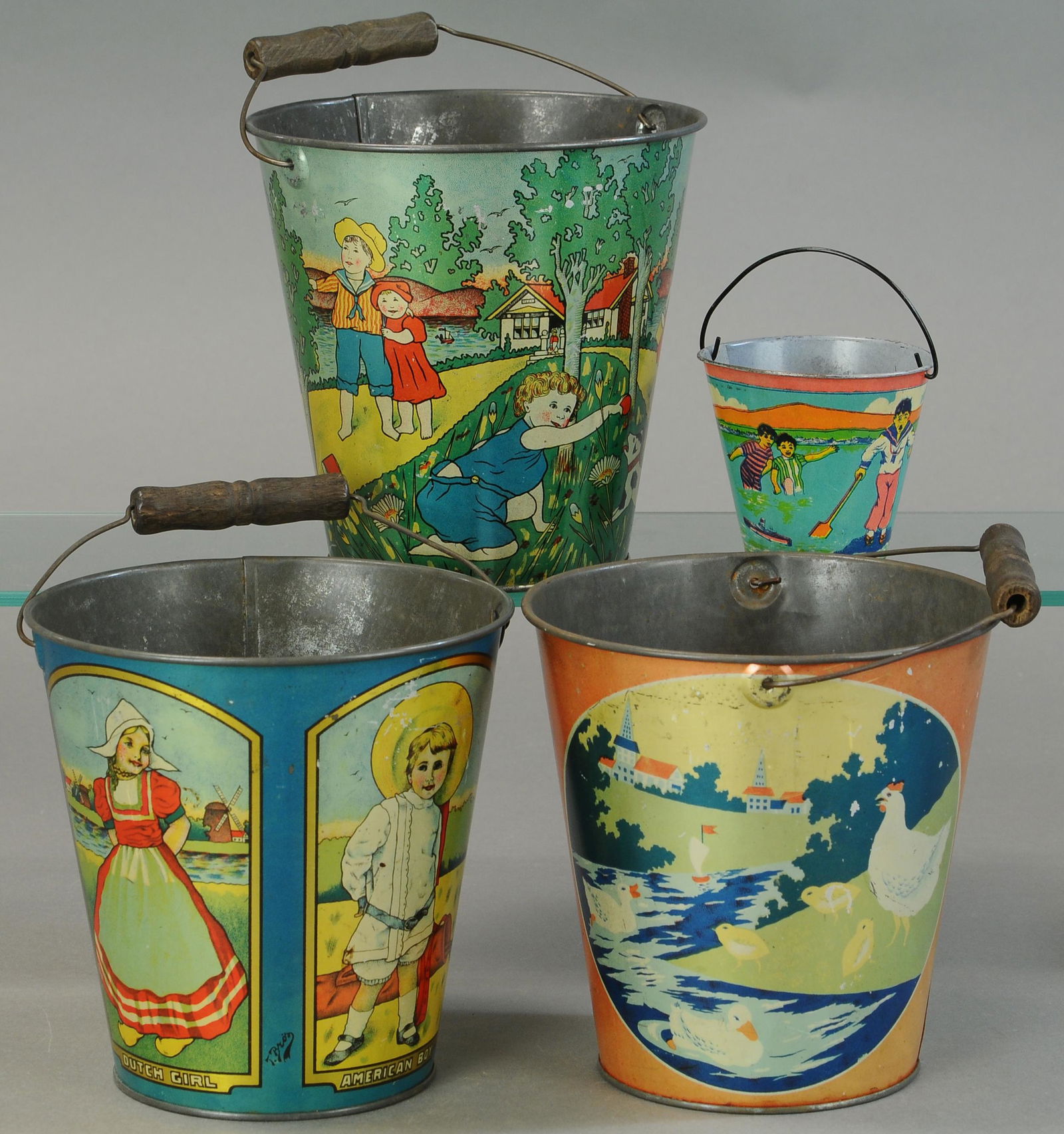 FOUR COLORFUL TIN LITHO SAND PAILS (1 of 2)