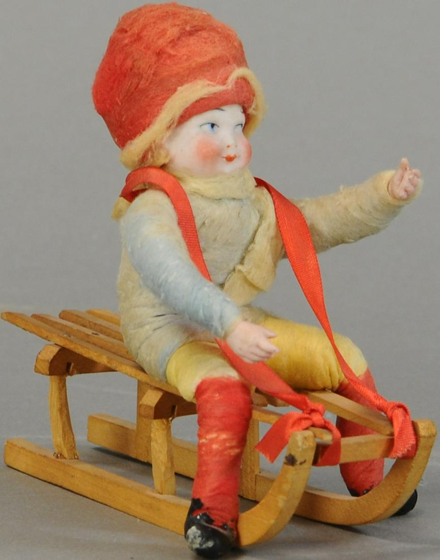 BISQUE HEAD CHILD ON SLEIGH (1 of 4)