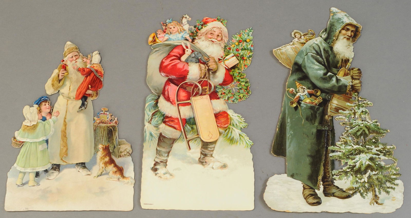 THREE EMBOSSED SANTA CLAUS DIE-CUTS (1 of 1)