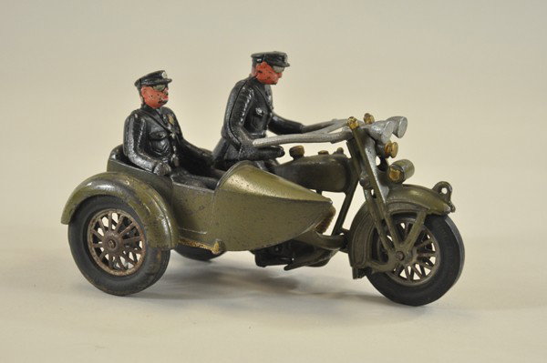 HARLEY DAVIDSON MOTORCYCLE WITH SIDECAR: Hubley, cast iron, olive green, one driver & a rider in attached side car, contains original Harley Davidson decal on gas tank. 9" l.