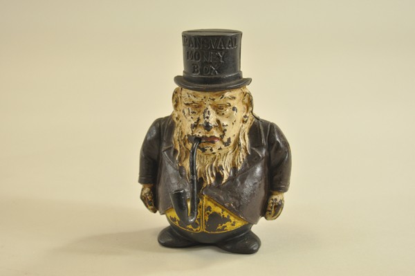 TRANSVAL MONEY BOX STILL BANK: John Harper, England, c. 1885, cast iron figural, depicts gentleman w/long beard and even longer pipe in mouth, top hat debossed. 6 3/16" h.
