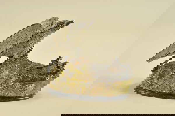 EAGLE & EAGLETS MECHANICAL BANK: J & E Stevens Co., designed by Charles M. Henn, Chicago, IL, patented 1/23/1883. Place a coin in the eagle's beak, press the lever and the eaglets rise from the nest, actually crying for food. As the