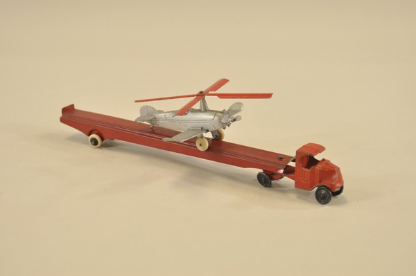 TOOTSIE CAR CARRIER AND AUTO-GYRO: Lot includes Mack transport with long tin body, and auto-gyro in grey airplane, red tin blades. 5" - 10 1/2" l.