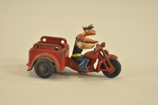 HUBLEY POPEYE "SPINACH" CYCLE: Cast iron, very whimsical depiction of Popeye riding open bed service cycle, embossed "SPINACH" on sides. 5 1/4" l.