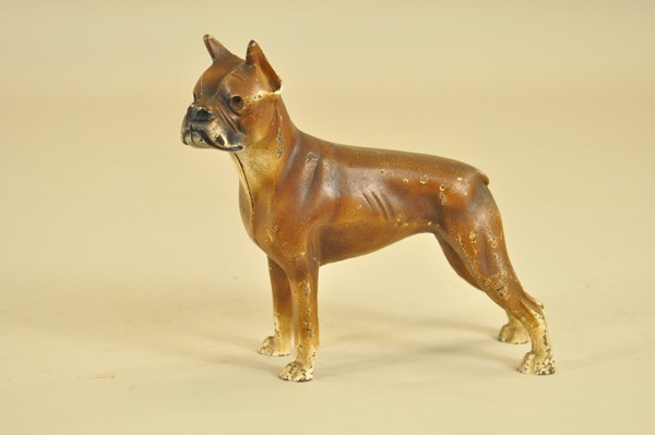 BOXER DOORSTOP: Hubley, full figure depiction of brown boxer with cream paws, pointed ears, and clipped tail. 9 1/2" w. x 8 1/2" h.