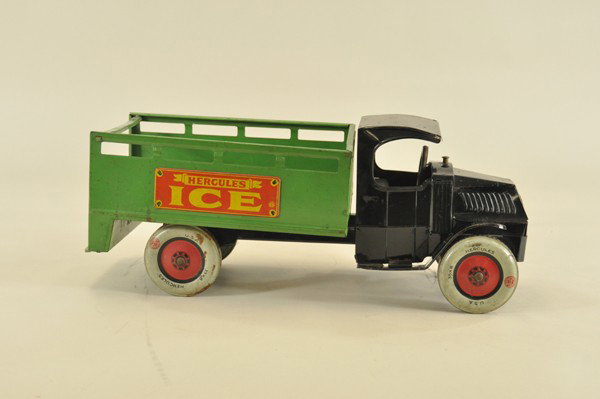 CHEIN HERCULES ICE TRUCK: Pressed steel, black "C" Mack cab with green open body, rear platform, lithographed plaques on sides read, "Hercules Ice," balloon wheels. 18 1/2" l.