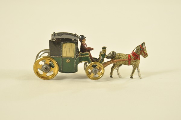 HORSEDRAWN CAB PENNY TOY: Solo driver in brown uniform, green and black cab is pulled by gold horse with red harness, an attractive example. 4 1/2" l.