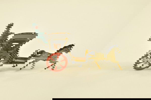 HANSOM CAB PENNY TOY: Attractive example, horse with flying mane pulls black cab with uniformed driver at rear, large red spoke wheels. 4 1/4" l.