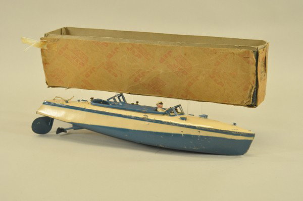 JEP SPEEDBOAT WITH BOX: c. 1930's, pressed steel, painted in cream and blue, seated pilot, clockwork driven, dual windshields and seating. 19" l.