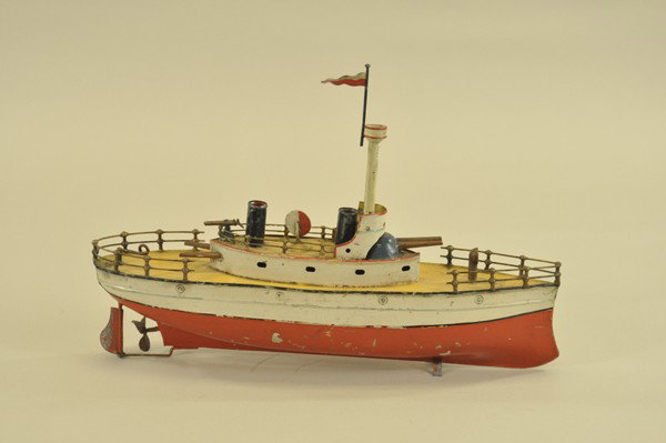 CARETTE GUNBOAT: Germany, hand painted tin, red and white hull, armored cabin with cannons at bow and stern, observation mast and two stacks, clockwork driven, partially railed deck. ` 14" l.