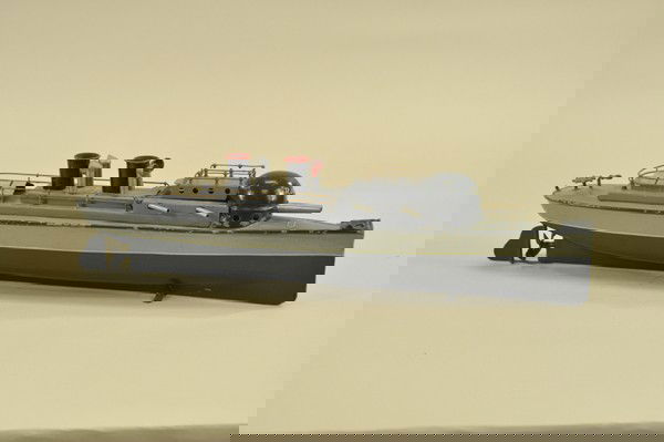 BING CANNON BOAT: Germany, hand painted tin, fashioned from Russo-Japanese War during early 1900's, light olive and dark colored hull, grey deck, turret marked "RJURIK," clockwork mechanism actually allowed timer to tr