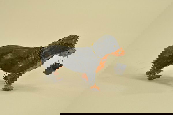 HAND PAINTED DACHSHUND WITH BASKET: Germany, attributed to Gunthermann, clockwork activated, well scaled and detailed, holds open basket in mouth, great action allowing head to turn side to side. 7" l.