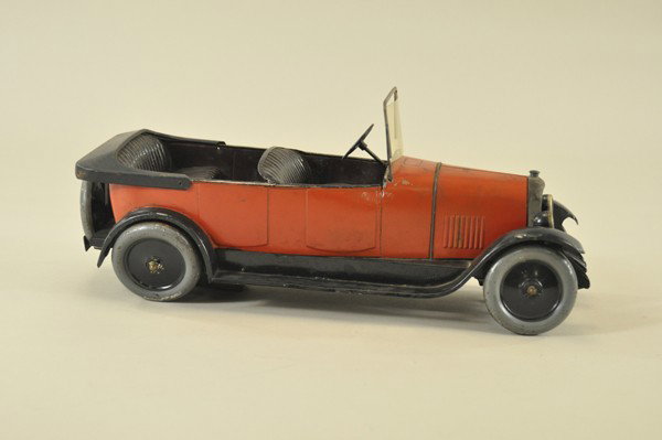 CITROEN B14 TORPEDO: France, c. 1920's, tin plate, body painted in red, dark embossed seating, full running boards, celluloid windshield, clockwork mechanism needs adjustment. 16" l.