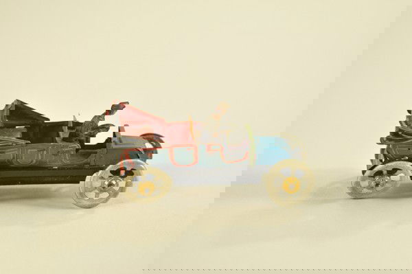 DISTLER PENNY TOY TAXI: Done in bright red and blue lithography, solo driver, simulated drop-down roof, meter at drivers door. 3" l.