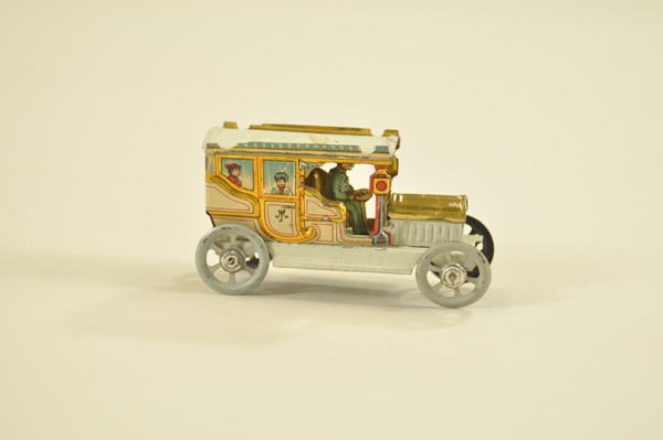 LIMOUSINE PENNY TOY: Meier, Germany, brightly lithographed auto done in multiple colors, depicts seated passengers at side windows, solo driver, Meier cart logo on rear. 3 1/8" l.