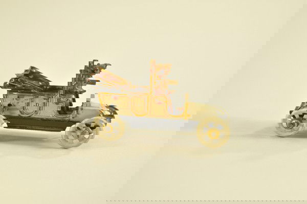 TAXI PENNY TOY: Distler, Germany, painted in white with gold trim, die-cut lamps, meter, and "For Hire" sign, single uniformed driver. 3 1/8 "l.