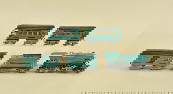 AMERICAN FLYER "O" GAUGE TRAIN SET: Includes 2-4-4 steam engine, electric powered, tender, together with #1213 coach car, #1214 baggage car, and #1217 observation car; all done in matching teal blue bodies and dark roofs, brass finished