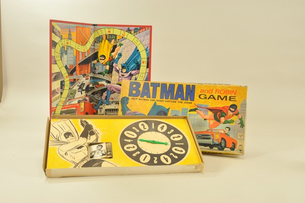 BATMAN & ROBIN BOARD GAME: Hasbro, 1965, Caped Crusader and sidekick battle the Joker, very colorful board graphics and interior insert with spinner, includes four playing pieces and twenty cards with movement instructions. Box