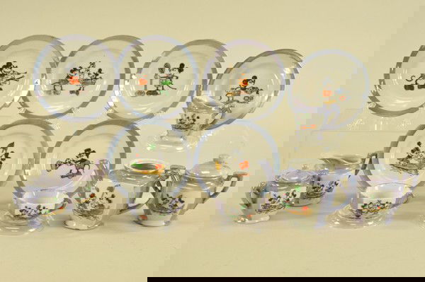 MICKEY MOUSE CHINA SET: Attractive lavender lusterware, child size pieces, made in Japan, includes: teapot (no lid), covered sugar, creamer, two cups, six plates and two smaller version creamer & sugar; all depict various sc