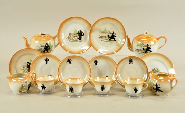 BENNETT POTTERY FELIX TEA SET: Decal decorated set with peach lustre finish around top borders, includes service for four: cups, saucers and dessert plates, lidded sugar, creamer, two teapots (one without lid); each piece decorated